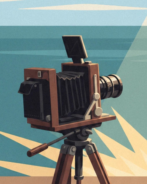 A wooden bellows camera on its tripod, facing the sea