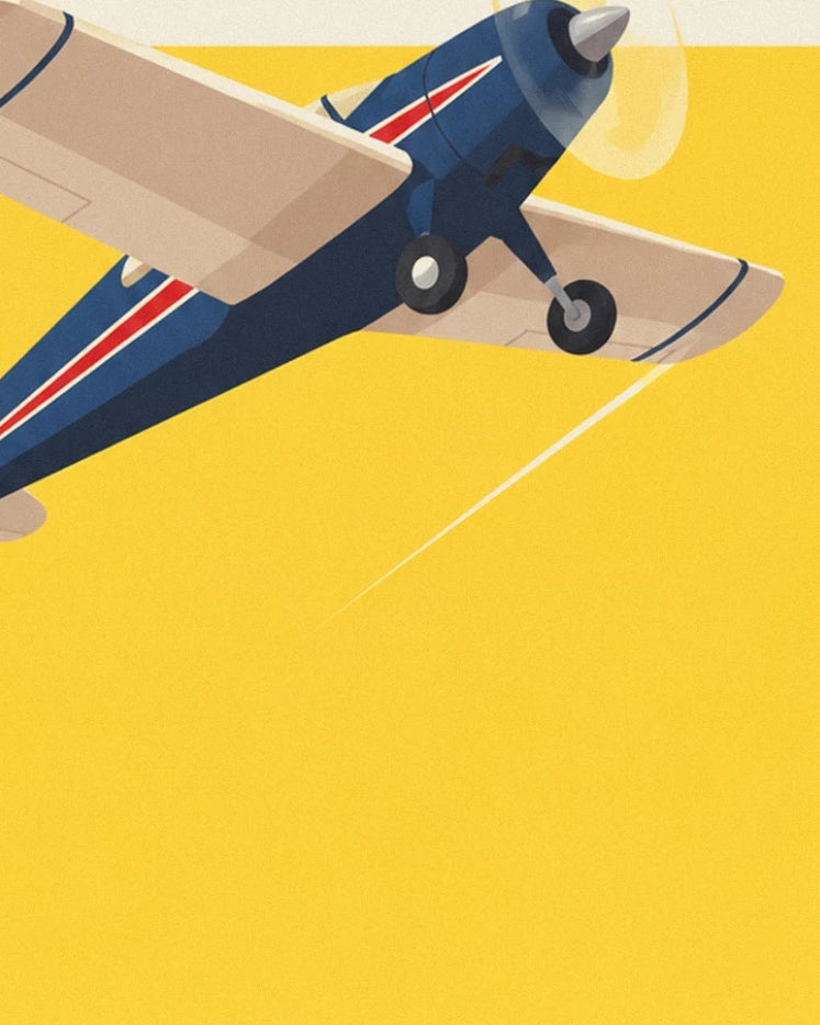 The front of the blue plane with its cream wings and propeller against the yellow sky