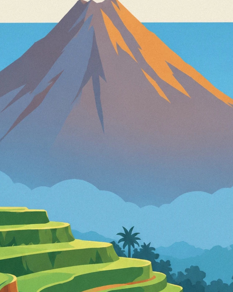 The orange slopes of mont Agung above the rice fields and palm trees