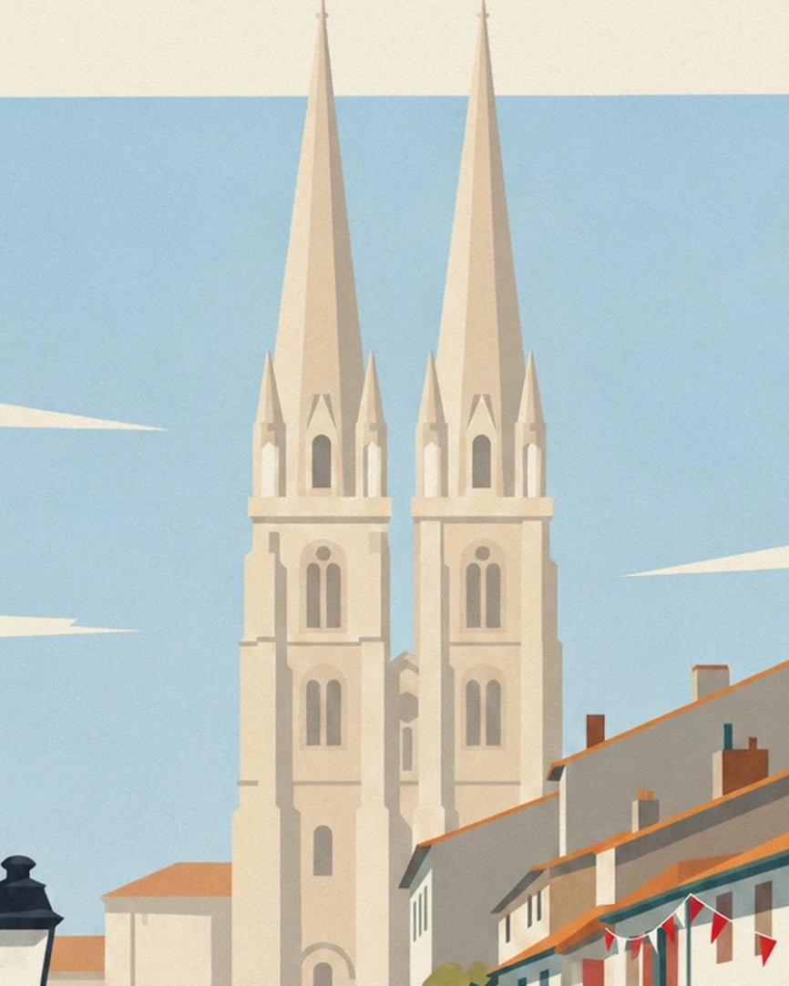 Les 2 flèches élancées de la cathédrale de Bayonne au-dessus des toits orangés