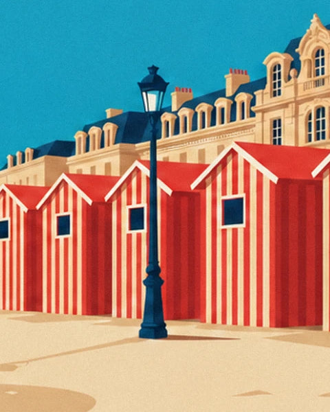 The midnight blue street lamp among the red beach huts, with the hotel in the background