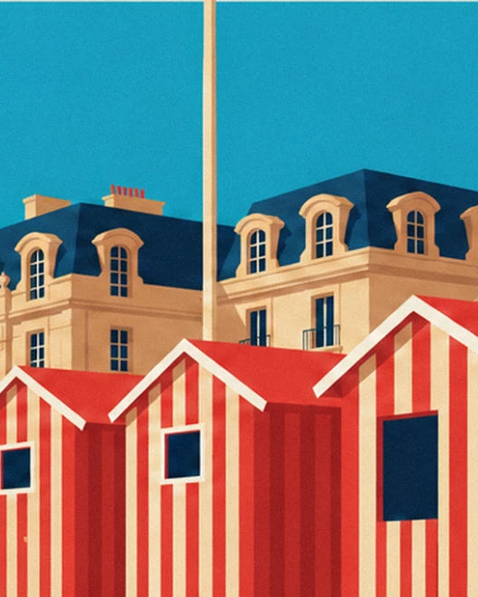 The red and cream striped beach huts in front of the hotel's façade with blue roofs and dormer windows