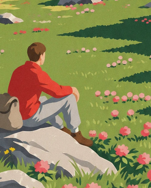 Le randonneur en pull rouge assis sur son rocher, face aux rhododendrons en fleurs