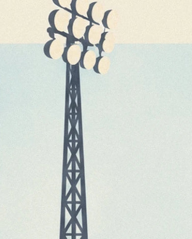 The dark metal tower and its cluster of floodlights