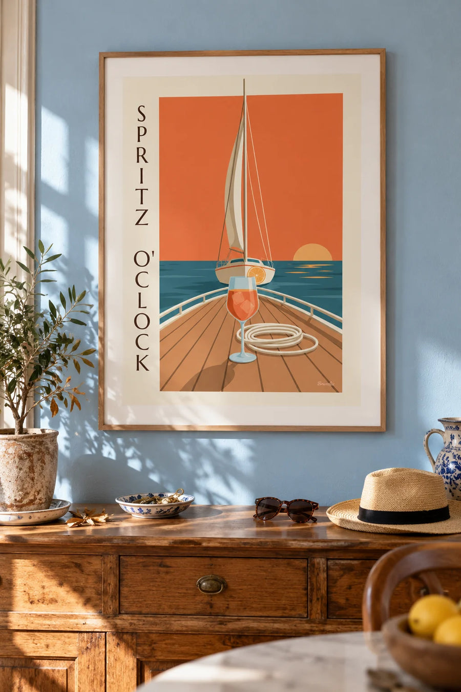 Póster spritz en la cubierta de un velero al atardecer: enmarcado en la pared