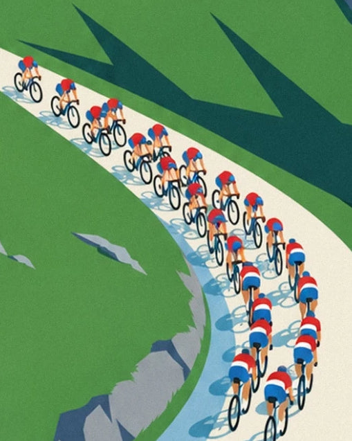 The peloton in red, white and blue jerseys on a hairpin bend lined with rocks