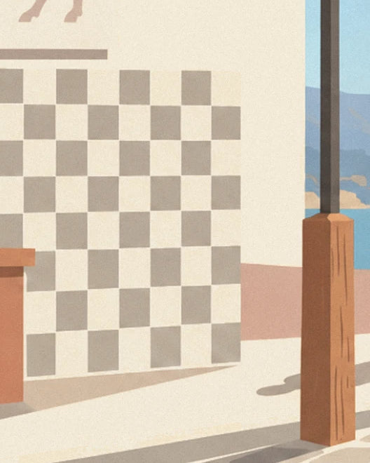 The grey and cream chequered wall, a brown wooden post and the sea beyond
