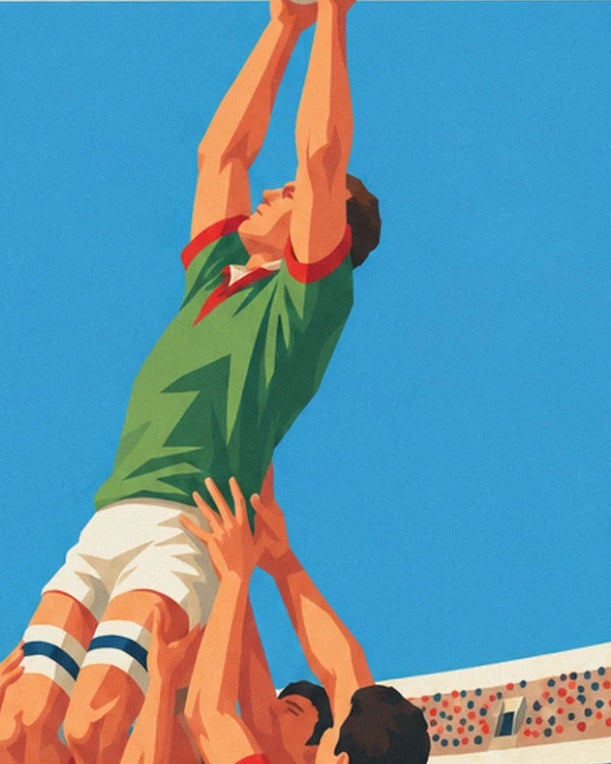 The jumper in a green jersey, arms reaching for the ball, lifted into the blue sky