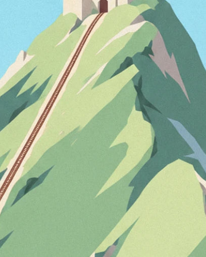 The rack railway running towards the summit and the small stone station at the very top