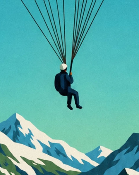Paraglider in a blue suit and white helmet, hanging from his lines above the snowy peaks
