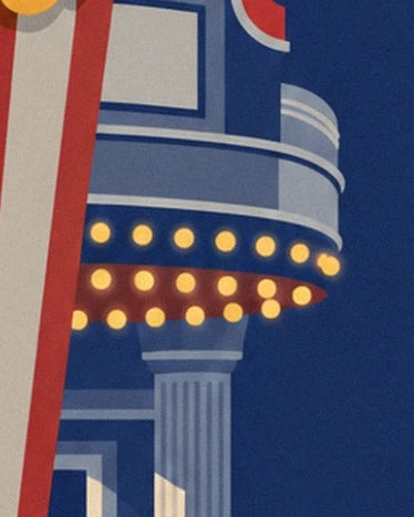 The cinema’s curved canopy and its yellow bulbs on the blue façade