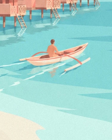 A paddler in an outrigger canoe on the turquoise waters of the lagoon