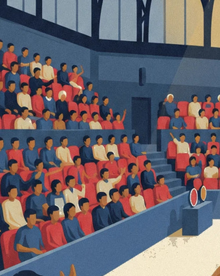 The spectators in red, blue and cream on the red seats in the stands