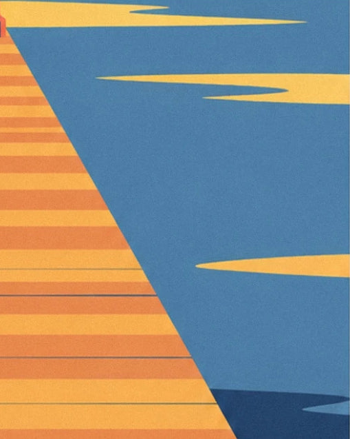 The pier's planks stretching towards the blue water, streaked with golden reflections