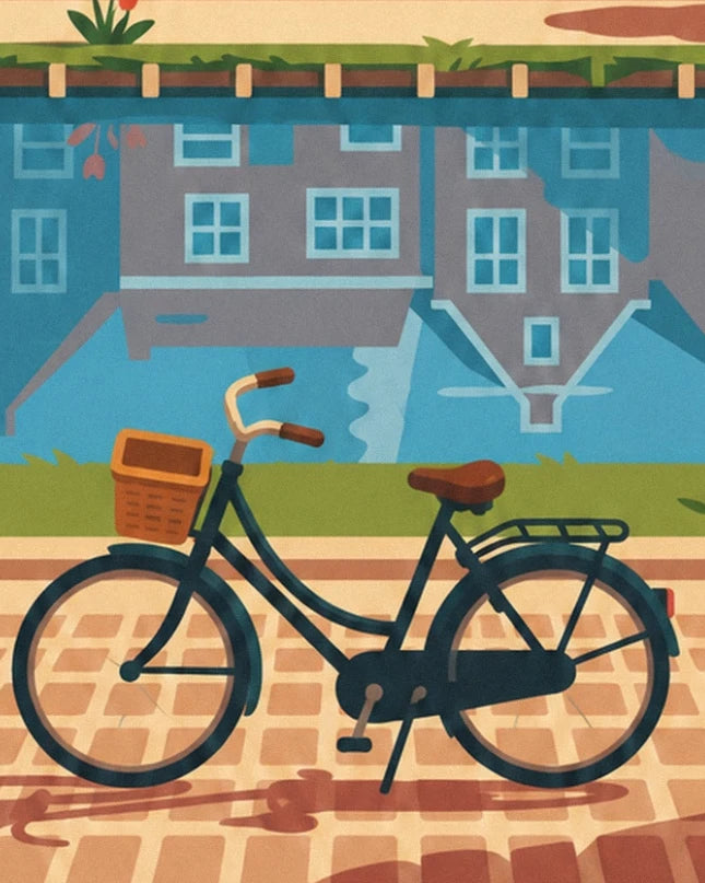 Le vélo hollandais noir avec son panier brun, au bord du canal et des pavés