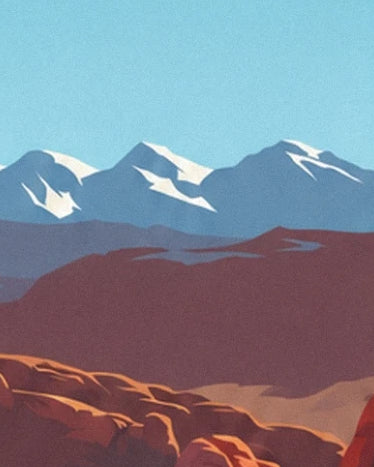 Les montagnes bleutées aux sommets enneigés derrière les rochers rouges de l’Utah