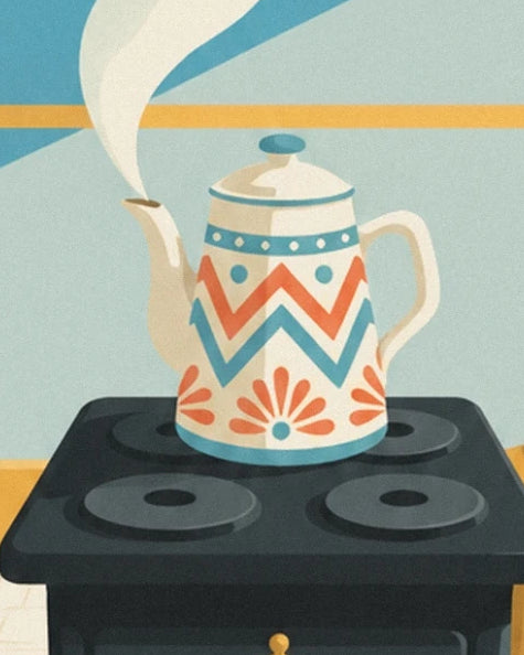 The cream kettle with turquoise and coral patterns on the black cooker