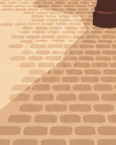 The beige paving stones of the Parisian terrace crossed by a diagonal shadow