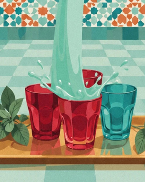 The red and turquoise glasses on a golden tray, surrounded by mint leaves