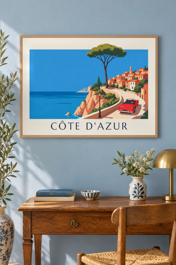 Red convertible on a French Riviera coast road poster