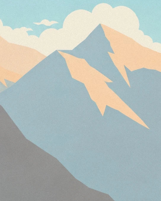The blue peaks with apricot slopes beneath large cream clouds