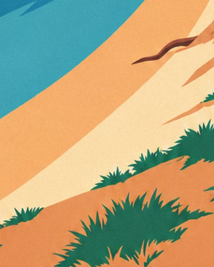 Golden sand dunes with tufts of green marram grass facing the turquoise sea