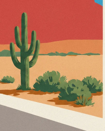 A tall saguaro cactus and green bushes on orange sand, beneath the red cliffs
