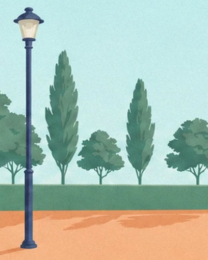 The blue lamppost and tall, slender trees along the edge of the clay court