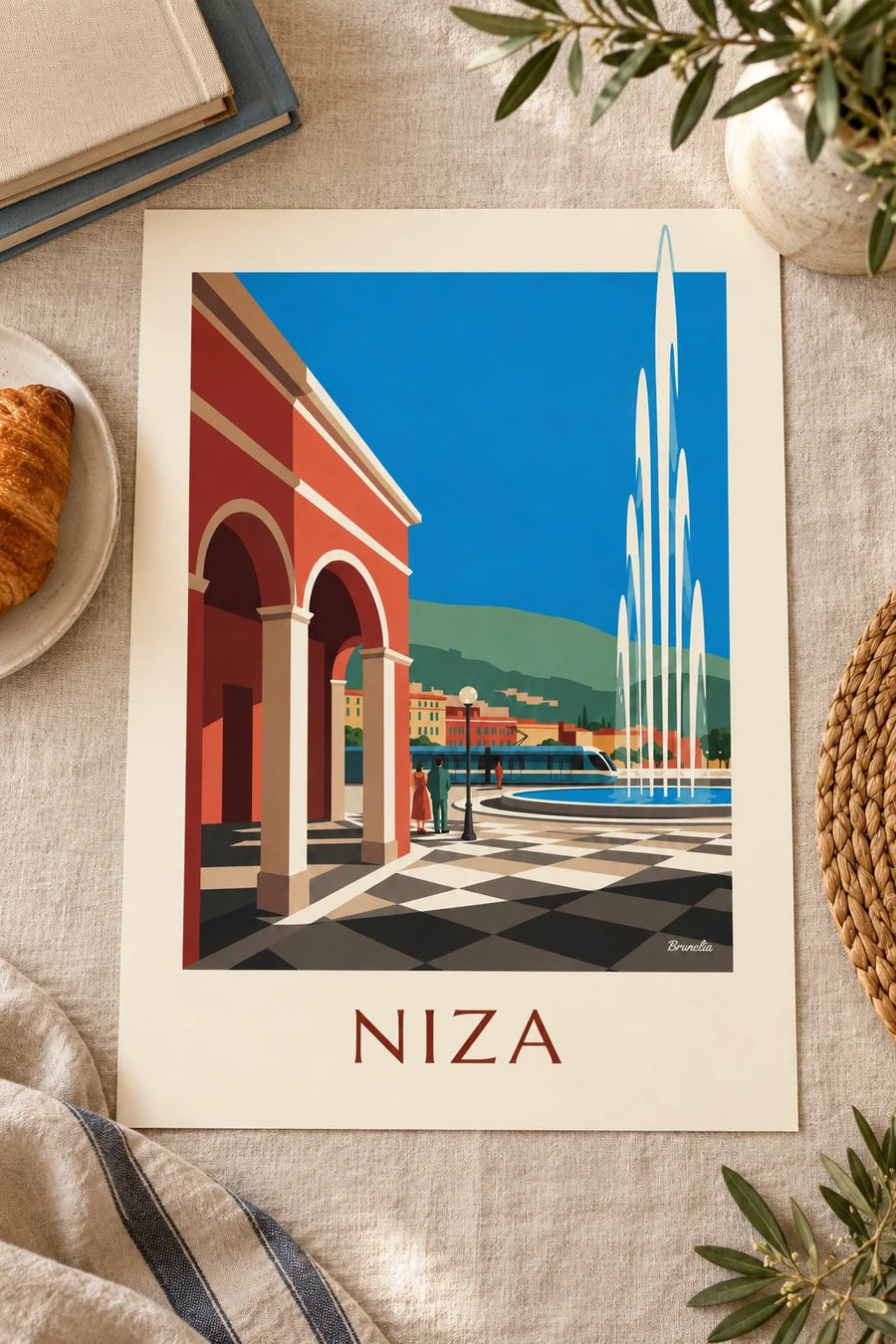 Póster plaza Masséna y sus fachadas rojas en Niza: apoyado sobre una mesa