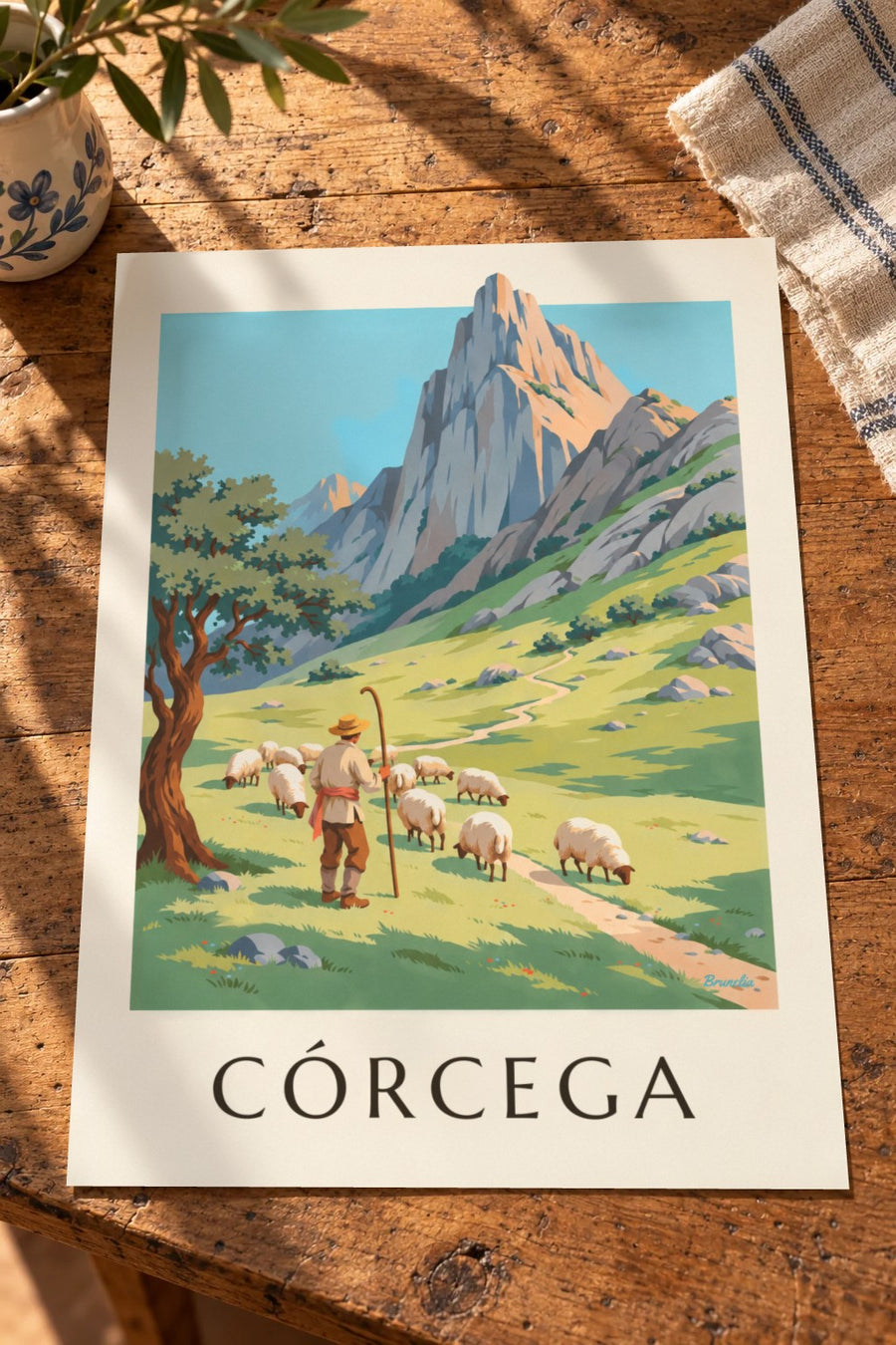 Póster de pastor con sus ovejas en las montañas de Córcega: apoyado sobre una mesa