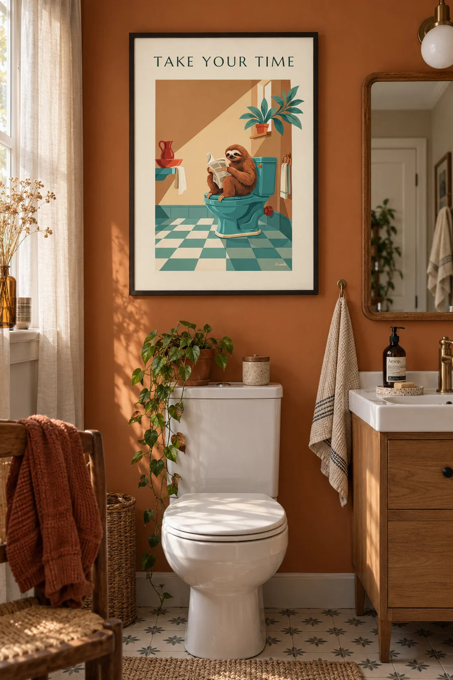 Humorous poster of a sloth reading the newspaper in the powder room: framed on the wall