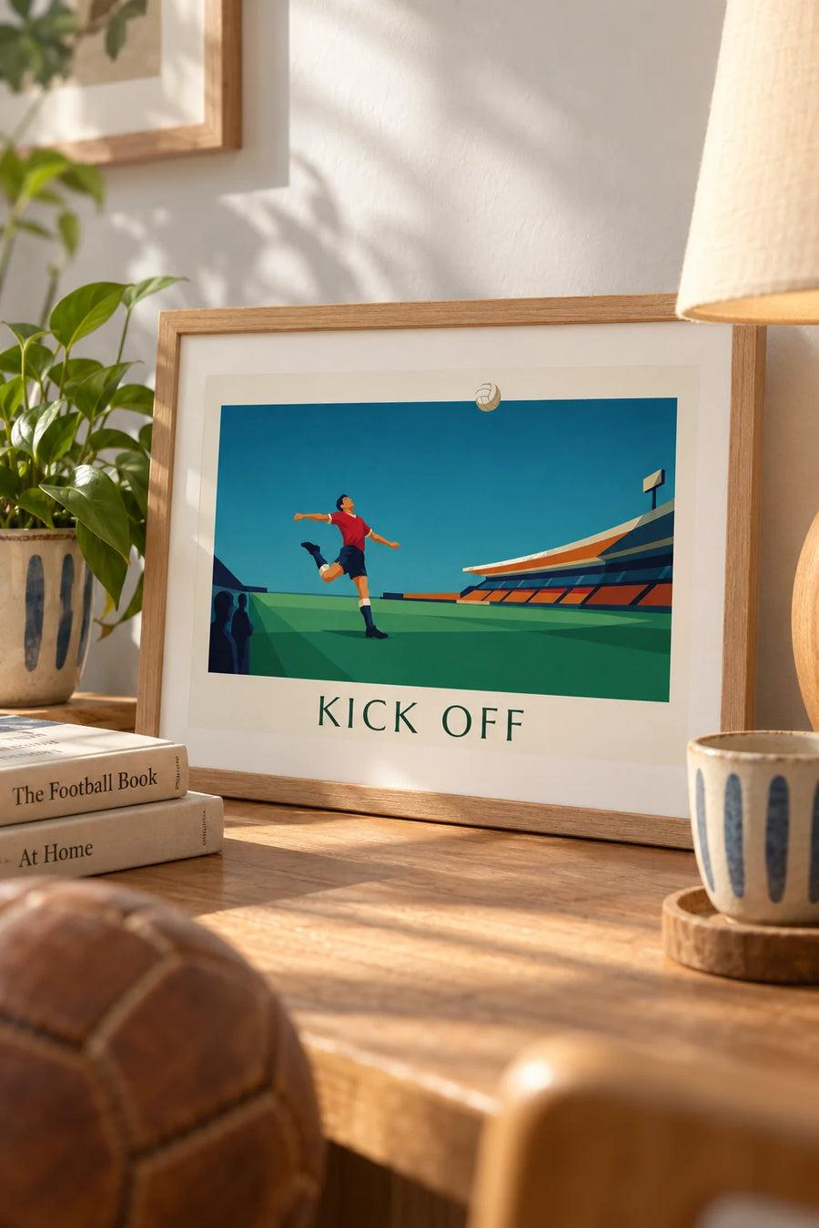 Poster of a soccer player kicking the ball in a stadium: small framed A4 size