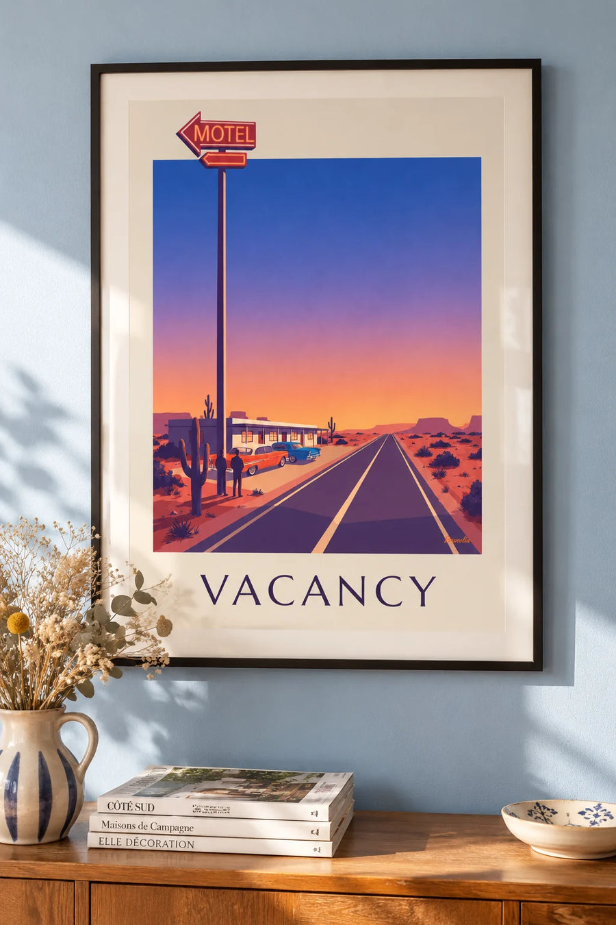 Póster letrero de neón de un motel al borde de una carretera del desierto: enmarcado en la pared