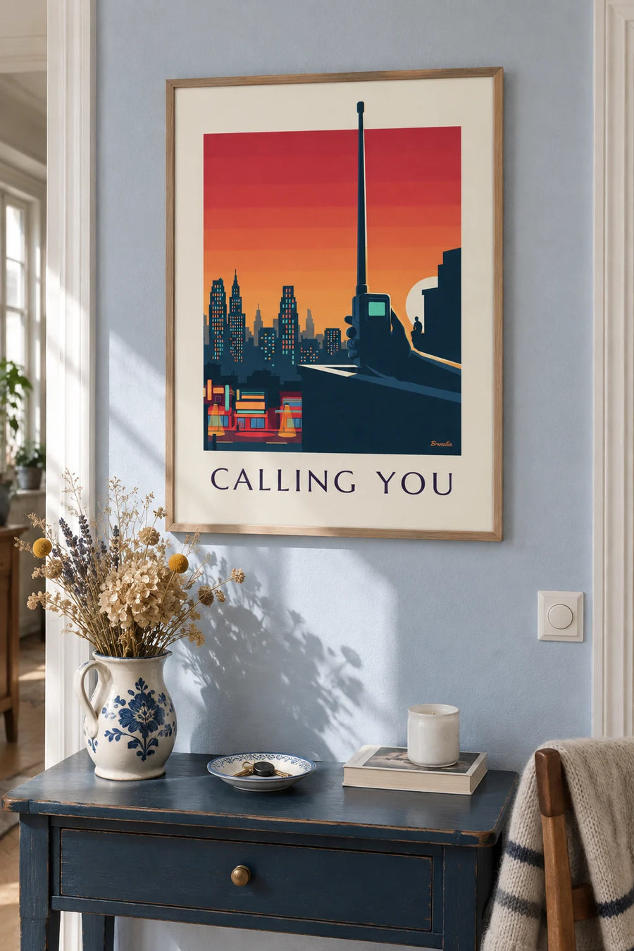 Poster of an old mobile phone with antenna in front of the city: framed on the wall